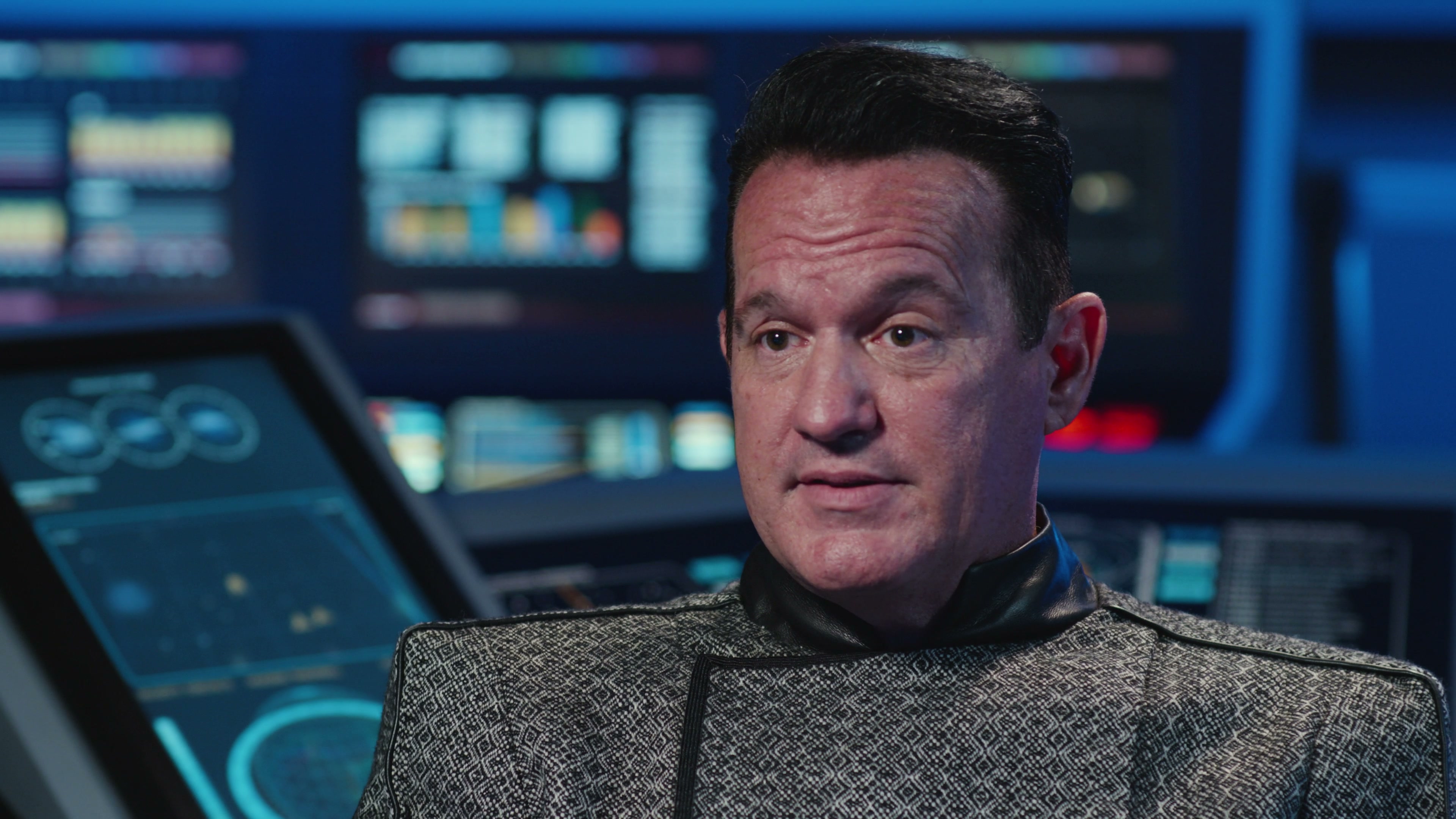 Starfleet officer in patterned service jacket